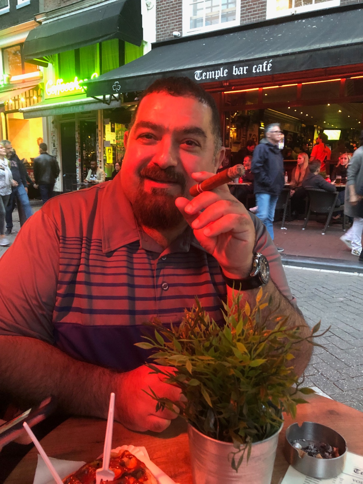 Imad smoking a cigar